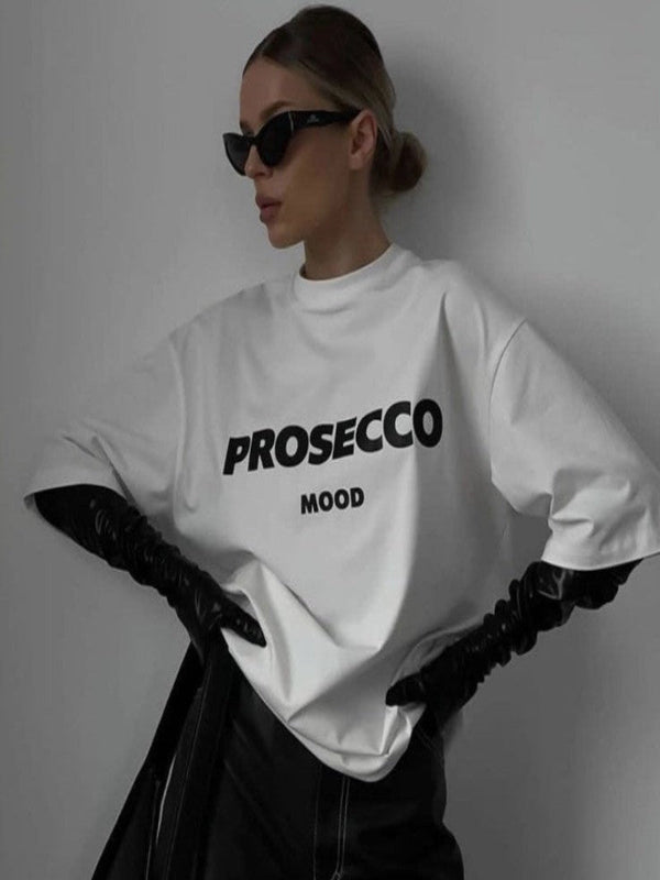 Charie | Das trendige Prosecco-Mood™ Tee in Übergröße